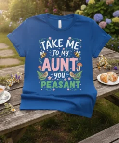 Take Me To My Aunt You Peasant funny quote on a blue t-shirt with bees, birds, mushrooms, and floral accents