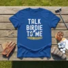 Blue t-shirt with white text "TALK BIRDIE TO ME" and a golf ball on a tee graphic