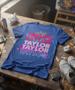 Taylor Taylor Taylor Taylor Taylor repeated name graphic on a blue t-shirt with crown and paint splatters