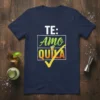 Navy t-shirt with "TE: Amo QUILA" text and a shot glass graphic, featuring a large yellow checkmark