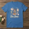 Tea Time T-Shirt featuring a charming illustration of a tiered stand with cupcakes, cookies, macarons, teapots, and teacups, surrounded by