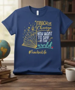 Navy blue t-shirt with "TEACH the Change you want TO SEE in the world #Teacherlife" quote and open book graphic
