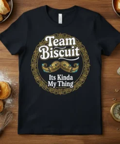 Team Biscuit Its Kinda My Thing text and ornate mustache graphic on a black t-shirt