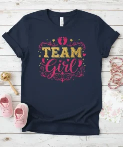 Team Girl text with gold glitter and pink script, decorated with baby feet and stars, on a navy t-shirt