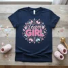 Navy blue t-shirt with "Team Girl" text in pink and light blue, surrounded by decorative elements, for gender reveal parties