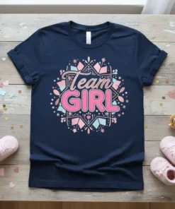 Navy blue t-shirt with "Team Girl" text in pink and light blue, surrounded by decorative elements, for gender reveal parties