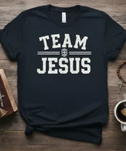 Team Jesus text graphic on a navy blue t-shirt, featuring white distressed collegiate style font
