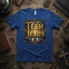 Team Jesus graphic tee with bold golden lettering and stained glass design, featuring angelic wings and crosses