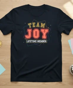 Team Joy Lifetime Member text in bold orange and yellow letters with a geometric frame on a dark navy t-shirt