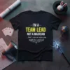 Black t-shirt with white text: "I'M A TEAM LEAD NOT A MAGICIAN ...but I can see why you might be