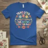 Team Sped We Grow With The Flow t-shirt with floral wreath and rainbow graphic for special education teachers