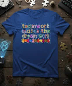 Teamwork makes the dream work quote with colorful puzzle pieces design on a blue t-shirt