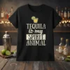 Tequila Is My Spirit Animal graphic tee with a distressed font and a margarita illustration, printed on a black t-shirt