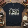 Thankful Blessed & Kind of a Mess quote on a dark navy t-shirt, distressed font style