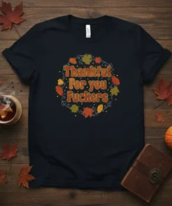 Thankful For you Fuckers text design with autumn leaves wreath on a black t-shirt