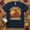 Thankful For You Fuckers humorous Thanksgiving t-shirt with a cartoon turkey holding beer and wearing sunglasses