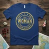 That Woman From Michigan text graphic in a distressed circular emblem on a blue t-shirt