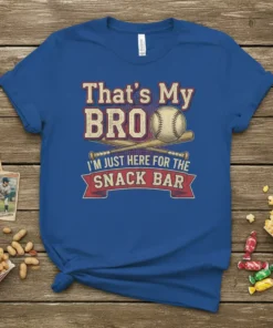 Text "That's My Bro I'm Just Here For The Snack Bar" with baseball and bats graphic on a blue t-shirt