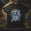 Black t-shirt with "THAT'S WHAT I DO I FIX STUFF AND I KNOW THINGS" text and mechanic gear graphics