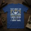 Graphic tee with "THAT'S WHAT I DO I GROW A BEARD AND I KNOW THINGS" text, Viking helmet, and axes