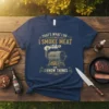 Navy blue t-shirt with "That's What I Do I Smoke Meat And I Know Things" text and a graphic of