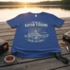 The Art of Kayak Fishing Explore Cast Catch t-shirt with angler on kayak graphic