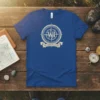 The Badger State WI compass design t-shirt in blue, featuring a nautical rope border and banner with state text