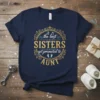 The best SISTERS get promoted to AUNT text design with decorative elements and baby footprints on a navy blue t-shirt