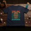 The Big Kahuna text above a fierce tiki mask with green wavy accents, printed on a navy t-shirt