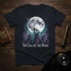 The Call of the Night t-shirt design featuring three lemurs looking up at a large full moon against a starry
