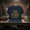 The Champ Is Here quote in gold glitter font on a navy t-shirt, surrounded by boxing gear