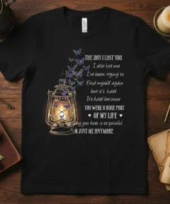 Memorial t-shirt with text "The Day I Lost You" and a lantern with butterflies, commemorating loss