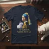 The Girl With The Pearering And The Cat text on a navy t-shirt with a parody of Vermeer's painting featuring