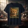 The Godfather cat design featuring an orange tabby cat smoking a cigarette with "The Godfather" text below