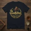 The Grandfather t-shirt with ornate golden text and a puppet hand graphic, symbolizing wisdom and guidance