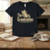 The Grandmother t-shirt design featuring vintage typography and an illustration of a grandmother sitting in a chair with a teacup