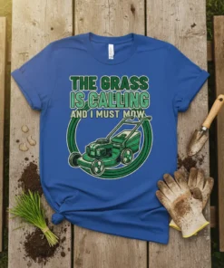 Blue t-shirt with green text "The Grass Is Calling And I Must Mow" and a green lawn mower graphic