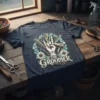 The Groomer t-shirt design featuring scissors, clippers, and a hand making a peace sign, surrounded by flowers