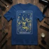 The Hairstylist Tarot Card T-Shirt featuring golden scissors and comb on navy blue background