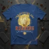 The Heavens Are Roaring The Praise Of His Glory T-Shirt with a golden roaring tiger graphic and Christian cross