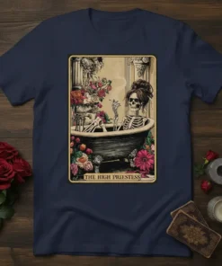 The High Priestess tarot card design featuring a skeleton in a bathtub with flowers, on a navy t-shirt