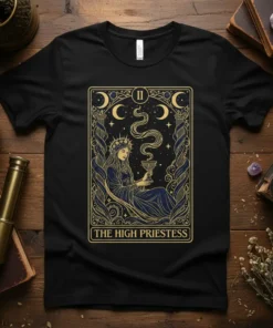 The High Priestess tarot card design with mystic woman holding a cup, moon phases, and stars on a black t-shirt