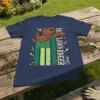 The Lawn Ranger text with cowboy hat and American flag background on a navy t-shirt. Includes gardening tools