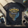The Legend Has Retired Freedom text with wings and compass graphic on a black t-shirt