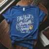 Christian t-shirt with "The Lord is my strength AND MY SONG" text and a golden acoustic guitar graphic, referencing Psalm