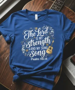 Christian t-shirt with "The Lord is my strength AND MY SONG" text and a golden acoustic guitar graphic, referencing Psalm