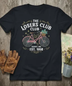 Black t-shirt with "THE LOSERS CLUB CLUB DERRY, ME EST. 1958" text and a pink retro bicycle with a flower