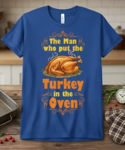 The Man who put the Turkey in the Oven Thanksgiving t-shirt with a roasted turkey graphic