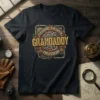 The Man The Myth Grandaddy The Legend text on a dark t-shirt with steampunk gear graphics