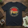 Vintage circle design with text "The Man The Myth Grumpy The Bad Influence" and mountain sunset graphic